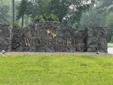 This .26 acres of undeveloped land in Woodlake Country Club is on Woodlake Country Club in North Carolina - for sale on GolfHomes.com, golf home, golf lot