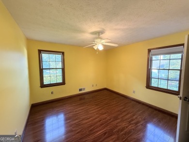 This well-maintained four-sided brick home features hardwood on Honey Creek Country Club in Georgia - for sale on GolfHomes.com, golf home, golf lot