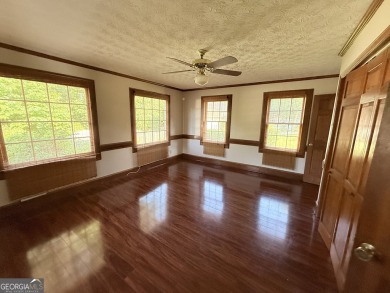 This well-maintained four-sided brick home features hardwood on Honey Creek Country Club in Georgia - for sale on GolfHomes.com, golf home, golf lot