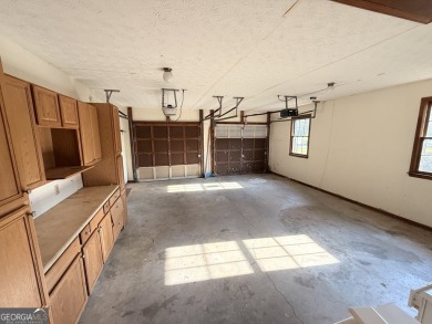 This well-maintained four-sided brick home features hardwood on Honey Creek Country Club in Georgia - for sale on GolfHomes.com, golf home, golf lot