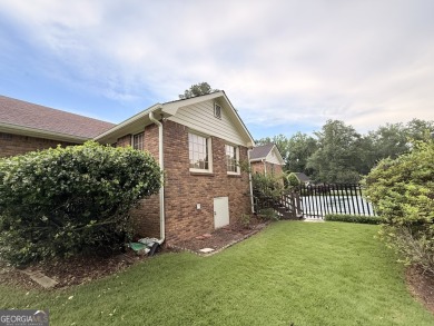This well-maintained four-sided brick home features hardwood on Honey Creek Country Club in Georgia - for sale on GolfHomes.com, golf home, golf lot
