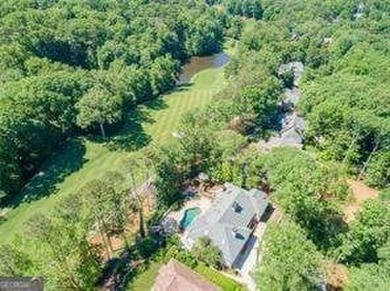 Tucked in Atlanta Country Club's quiet interior, this refreshed on Atlanta Country Club in Georgia - for sale on GolfHomes.com, golf home, golf lot