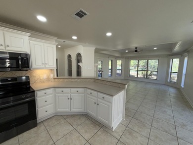 Updated one level 4 bed 2 bath on the golf course! 3 car garage on The Country Club of Arkansas in Arkansas - for sale on GolfHomes.com, golf home, golf lot