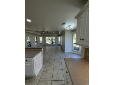 Updated one level 4 bed 2 bath on the golf course! 3 car garage on The Country Club of Arkansas in Arkansas - for sale on GolfHomes.com, golf home, golf lot
