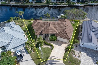 CUSTOM WATERFRONT HOME IN BSI ON KEY LOT W/**NEW METAL TILE on Twin Isles Country Club in Florida - for sale on GolfHomes.com, golf home, golf lot