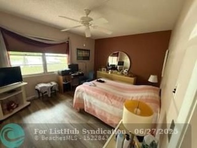 1st floor unit.  Larger one bedroom.  Vinyl flooring throughout on  in Florida - for sale on GolfHomes.com, golf home, golf lot