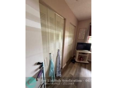 1st floor unit.  Larger one bedroom.  Vinyl flooring throughout on  in Florida - for sale on GolfHomes.com, golf home, golf lot