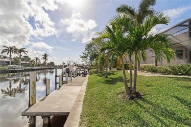 CUSTOM WATERFRONT HOME IN BSI ON KEY LOT W/**NEW METAL TILE on Twin Isles Country Club in Florida - for sale on GolfHomes.com, golf home, golf lot