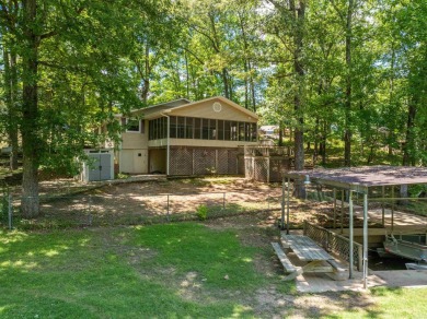 Cute open floorplan cottage on Lake Catherine in Diamondhead on Diamondhead Golf and Country Club in Arkansas - for sale on GolfHomes.com, golf home, golf lot