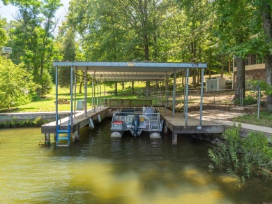 Cute open floorplan cottage on Lake Catherine in Diamondhead on Diamondhead Golf and Country Club in Arkansas - for sale on GolfHomes.com, golf home, golf lot