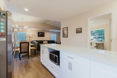 Welcome to this spacious and updated home in Northeast St on Mangrove Bay Golf Course in Florida - for sale on GolfHomes.com, golf home, golf lot