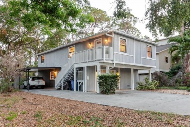 Welcome to this spacious and updated home in Northeast St on Mangrove Bay Golf Course in Florida - for sale on GolfHomes.com, golf home, golf lot