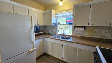 Welcome to your perfect retirement oasis in the charming city of on Herons Glen Golf and Country Club in Florida - for sale on GolfHomes.com, golf home, golf lot
