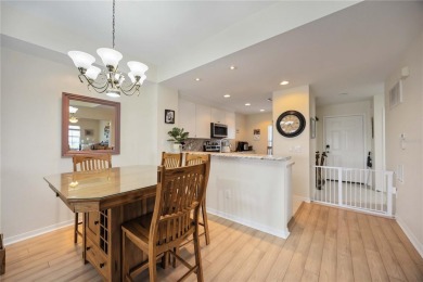 Enjoy waterfront living in this turnkey bright end-unit villa on Sabal Trace Golf and Country Club in Florida - for sale on GolfHomes.com, golf home, golf lot