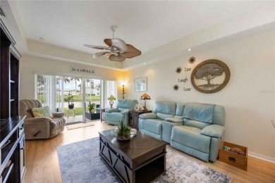 Enjoy waterfront living in this turnkey bright end-unit villa on Sabal Trace Golf and Country Club in Florida - for sale on GolfHomes.com, golf home, golf lot
