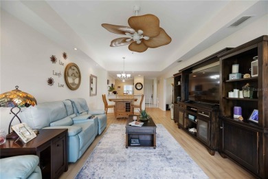 Enjoy waterfront living in this turnkey bright end-unit villa on Sabal Trace Golf and Country Club in Florida - for sale on GolfHomes.com, golf home, golf lot