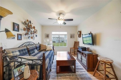 Enjoy waterfront living in this turnkey bright end-unit villa on Sabal Trace Golf and Country Club in Florida - for sale on GolfHomes.com, golf home, golf lot