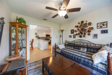 Enjoy waterfront living in this turnkey bright end-unit villa on Sabal Trace Golf and Country Club in Florida - for sale on GolfHomes.com, golf home, golf lot