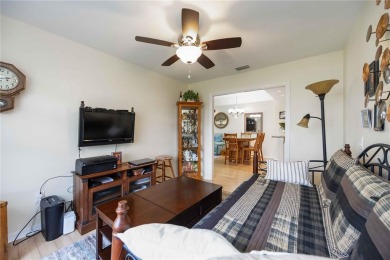 Enjoy waterfront living in this turnkey bright end-unit villa on Sabal Trace Golf and Country Club in Florida - for sale on GolfHomes.com, golf home, golf lot