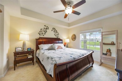 Enjoy waterfront living in this turnkey bright end-unit villa on Sabal Trace Golf and Country Club in Florida - for sale on GolfHomes.com, golf home, golf lot