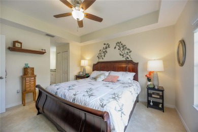 Enjoy waterfront living in this turnkey bright end-unit villa on Sabal Trace Golf and Country Club in Florida - for sale on GolfHomes.com, golf home, golf lot