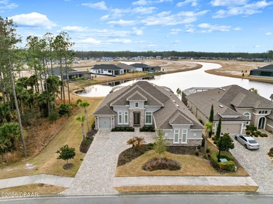 Welcome to 301 Stirling Bridge Drive, where breathtaking western on Plantation Bay Golf and Country Club in Florida - for sale on GolfHomes.com, golf home, golf lot