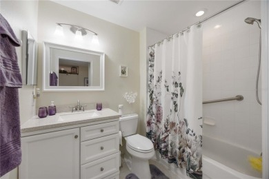 Enjoy waterfront living in this turnkey bright end-unit villa on Sabal Trace Golf and Country Club in Florida - for sale on GolfHomes.com, golf home, golf lot