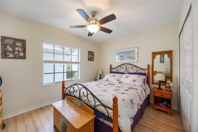 Enjoy waterfront living in this turnkey bright end-unit villa on Sabal Trace Golf and Country Club in Florida - for sale on GolfHomes.com, golf home, golf lot