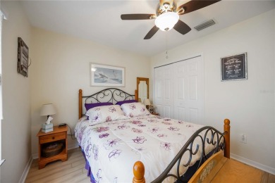 Enjoy waterfront living in this turnkey bright end-unit villa on Sabal Trace Golf and Country Club in Florida - for sale on GolfHomes.com, golf home, golf lot