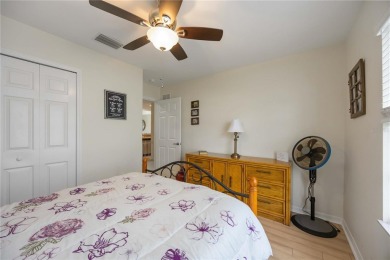 Enjoy waterfront living in this turnkey bright end-unit villa on Sabal Trace Golf and Country Club in Florida - for sale on GolfHomes.com, golf home, golf lot