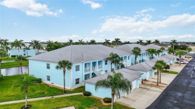 Enjoy waterfront living in this turnkey bright end-unit villa on Sabal Trace Golf and Country Club in Florida - for sale on GolfHomes.com, golf home, golf lot
