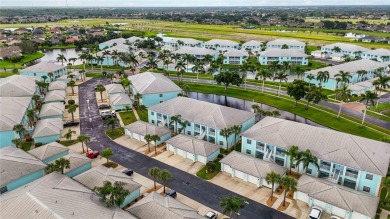 Enjoy waterfront living in this turnkey bright end-unit villa on Sabal Trace Golf and Country Club in Florida - for sale on GolfHomes.com, golf home, golf lot