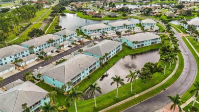 Enjoy waterfront living in this turnkey bright end-unit villa on Sabal Trace Golf and Country Club in Florida - for sale on GolfHomes.com, golf home, golf lot