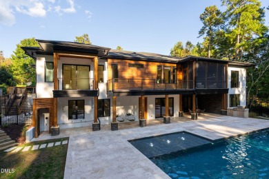 Elegant Modern Style home with views of a forested backyard and on The Preserve At Jordan Lake Golf Club in North Carolina - for sale on GolfHomes.com, golf home, golf lot