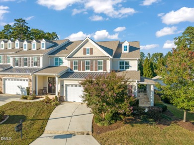 Discover luxury living in this stunning, end-unit townhome on on TPC at Wakefield Plantation in North Carolina - for sale on GolfHomes.com, golf home, golf lot