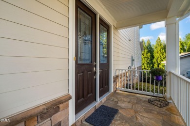 Discover luxury living in this stunning, end-unit townhome on on TPC at Wakefield Plantation in North Carolina - for sale on GolfHomes.com, golf home, golf lot