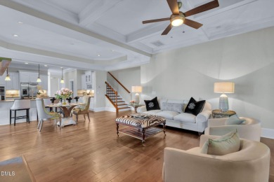 Discover luxury living in this stunning, end-unit townhome on on TPC at Wakefield Plantation in North Carolina - for sale on GolfHomes.com, golf home, golf lot