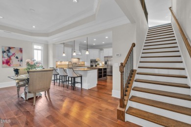 Discover luxury living in this stunning, end-unit townhome on on TPC at Wakefield Plantation in North Carolina - for sale on GolfHomes.com, golf home, golf lot