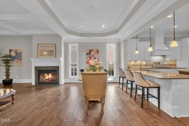 Discover luxury living in this stunning, end-unit townhome on on TPC at Wakefield Plantation in North Carolina - for sale on GolfHomes.com, golf home, golf lot