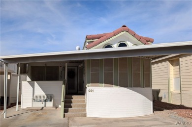 This is a beautiful home. New vinyl plank flooring in family on Riverview Golf Course in Arizona - for sale on GolfHomes.com, golf home, golf lot