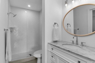 Enjoy refined living in this fully renovated end-unit residence on Glen Eagle Golf and Country Club in Florida - for sale on GolfHomes.com, golf home, golf lot