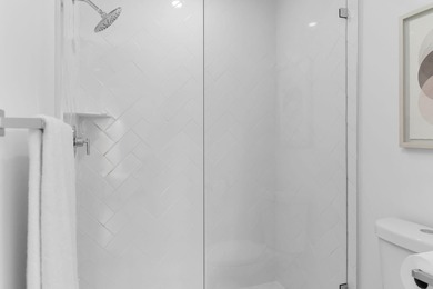 Enjoy refined living in this fully renovated end-unit residence on Glen Eagle Golf and Country Club in Florida - for sale on GolfHomes.com, golf home, golf lot