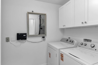 Enjoy refined living in this fully renovated end-unit residence on Glen Eagle Golf and Country Club in Florida - for sale on GolfHomes.com, golf home, golf lot