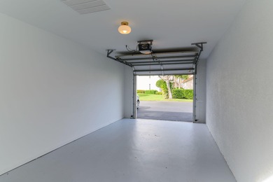 Enjoy refined living in this fully renovated end-unit residence on Glen Eagle Golf and Country Club in Florida - for sale on GolfHomes.com, golf home, golf lot