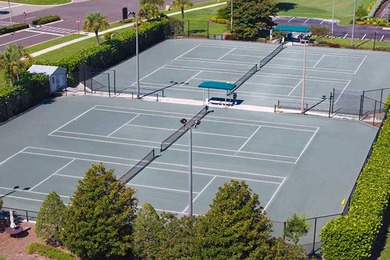 Enjoy refined living in this fully renovated end-unit residence on Glen Eagle Golf and Country Club in Florida - for sale on GolfHomes.com, golf home, golf lot