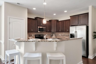 Welcome to this impeccably maintained 4-bedroom home nestled in on Beau Rivage Golf and Resort in North Carolina - for sale on GolfHomes.com, golf home, golf lot