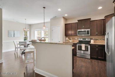 Welcome to this impeccably maintained 4-bedroom home nestled in on Beau Rivage Golf and Resort in North Carolina - for sale on GolfHomes.com, golf home, golf lot