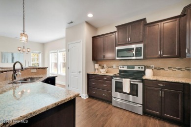 Welcome to this impeccably maintained 4-bedroom home nestled in on Beau Rivage Golf and Resort in North Carolina - for sale on GolfHomes.com, golf home, golf lot