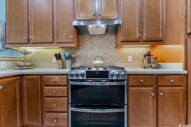 Discover this lovingly maintained 4-bedroom, 3-bath home in the on International Club of Myrtle Beach in South Carolina - for sale on GolfHomes.com, golf home, golf lot
