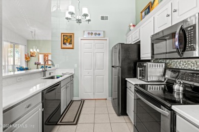 Step into this sought-after second-floor end-unit condominium in on St. Augustine Shores Golf Club in Florida - for sale on GolfHomes.com, golf home, golf lot